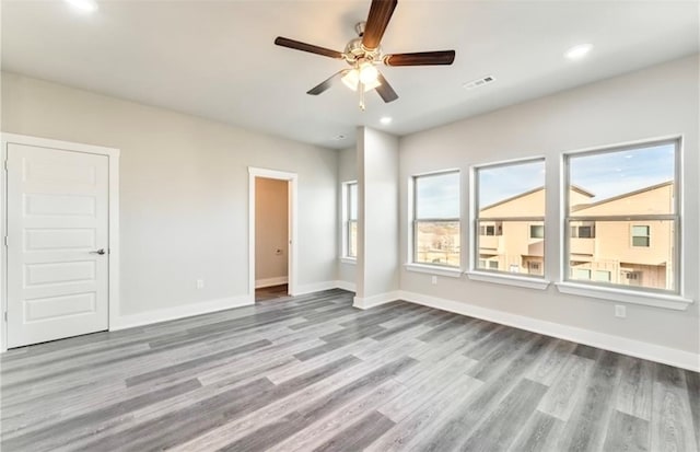 unfurnished bedroom with light hardwood / wood-style flooring and ceiling fan