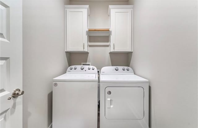 laundry area featuring cabinets and independent washer and dryer