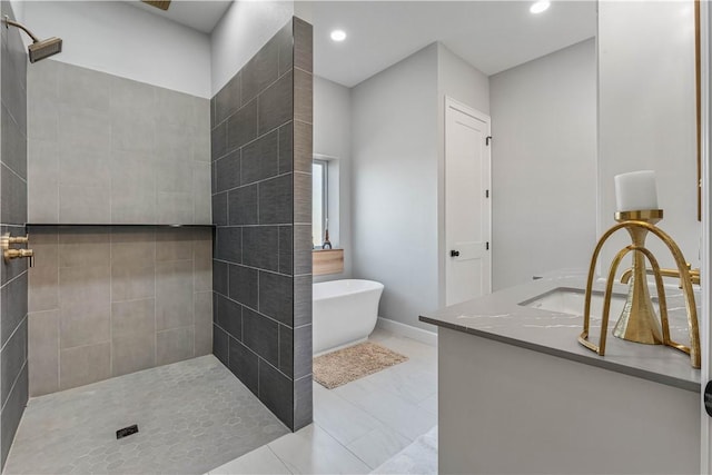 bathroom featuring recessed lighting, a soaking tub, tiled shower, and vanity