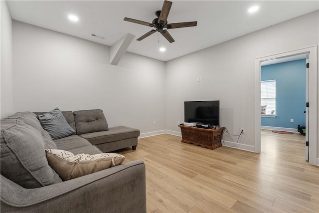 living area featuring recessed lighting, a ceiling fan, baseboards, visible vents, and light wood-style floors