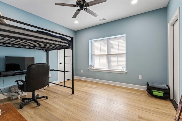 bedroom with light wood-type flooring, visible vents, baseboards, and recessed lighting