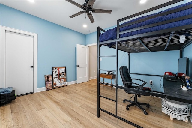 bedroom featuring recessed lighting, baseboards, and wood finished floors