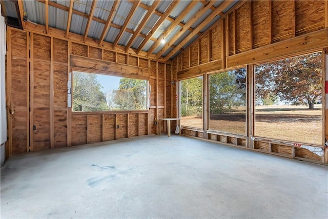 unfurnished sunroom with vaulted ceiling