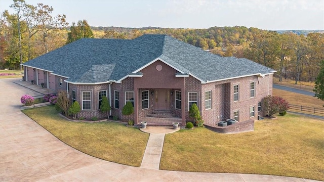 14600 S Mountain, Lowell, AR 72745 - traditional home with brick siding, roof with shingles, and a garage