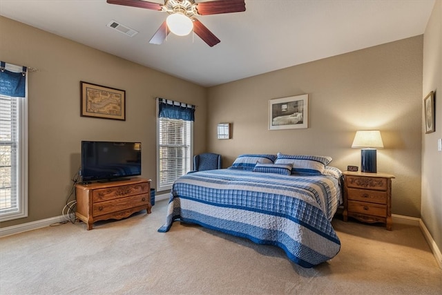 bedroom with light colored carpet and ceiling fan