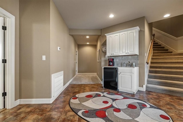 14600 S Mountain, Lowell, AR 72745 - indoor wet bar with beverage cooler, stairway, baseboards, and recessed lighting