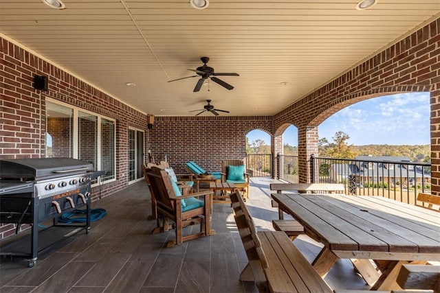 view of patio with grilling area and ceiling fan