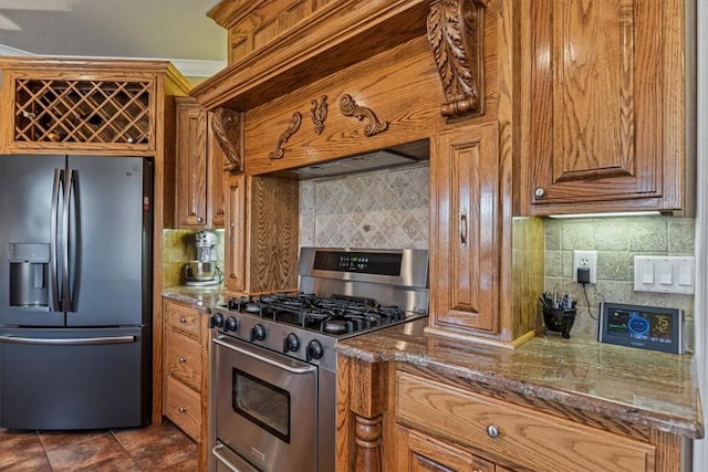 14600 S Mountain, Lowell, AR 72745 - kitchen with fridge with ice dispenser, gas range, tasteful backsplash, and brown cabinets