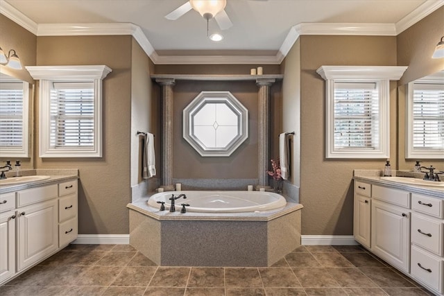 bathroom featuring vanity, tiled tub, and ornamental molding