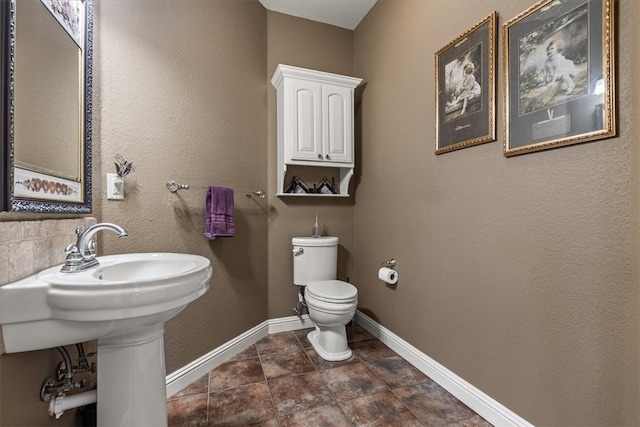 bathroom featuring toilet