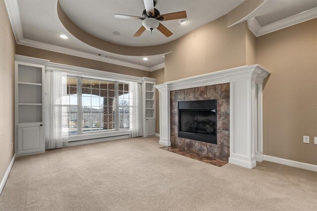 14600 S Mountain, Lowell, AR 72745 - unfurnished living room featuring carpet flooring, ceiling fan, a tile fireplace, ornamental molding, and recessed lighting