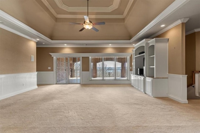 14600 S Mountain, Lowell, AR 72745 - unfurnished living room with a raised ceiling, light carpet, a ceiling fan, crown molding, and a wainscoted wall