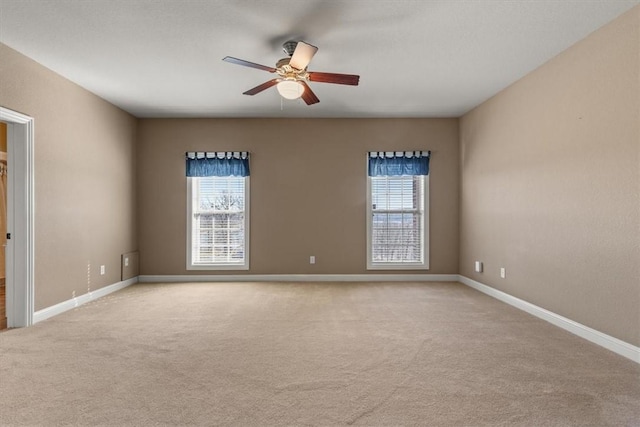 14600 S Mountain, Lowell, AR 72745 - empty room with healthy amount of natural light, carpet floors, ceiling fan, and baseboards