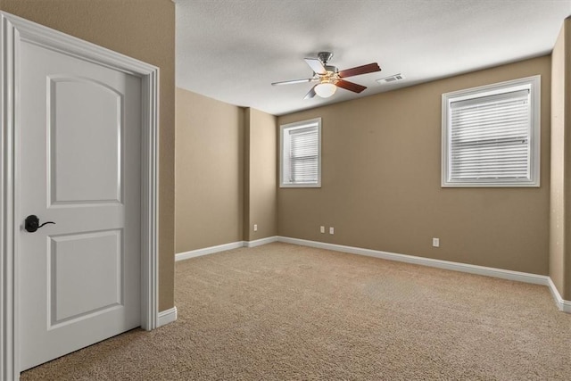 14600 S Mountain, Lowell, AR 72745 - unfurnished bedroom with light colored carpet, baseboards, and a ceiling fan