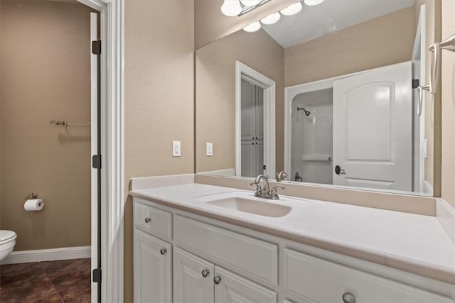 14600 S Mountain, Lowell, AR 72745 - bathroom featuring toilet, vanity, tile patterned flooring, and baseboards