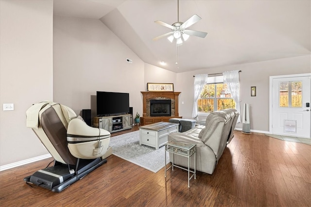 living room with wood-type flooring, vaulted ceiling, and ceiling fan