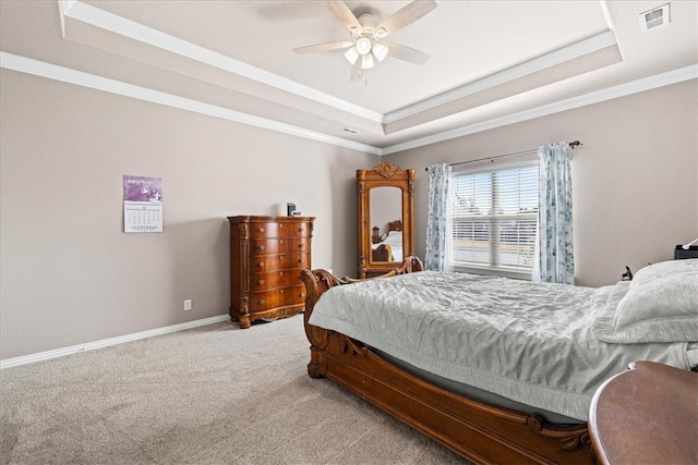 bedroom with light carpet, a raised ceiling, and ceiling fan