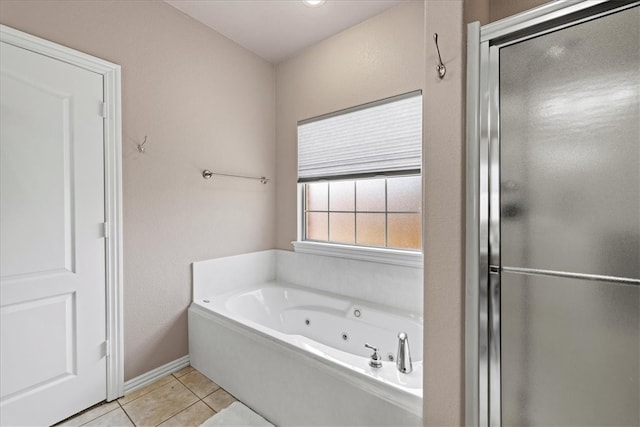 bathroom with tile patterned flooring and independent shower and bath