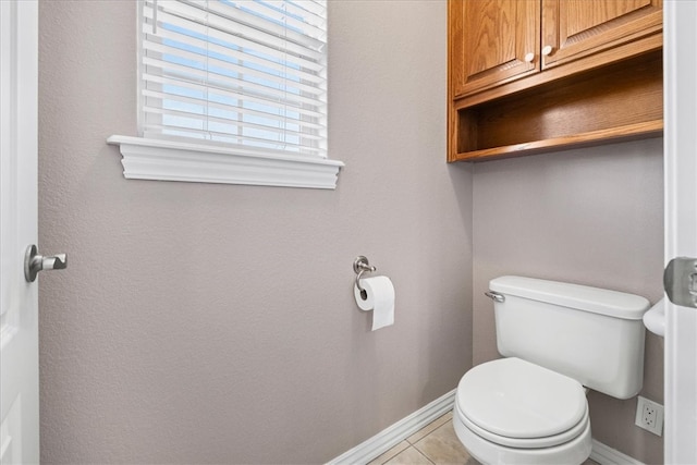 bathroom with tile patterned floors and toilet