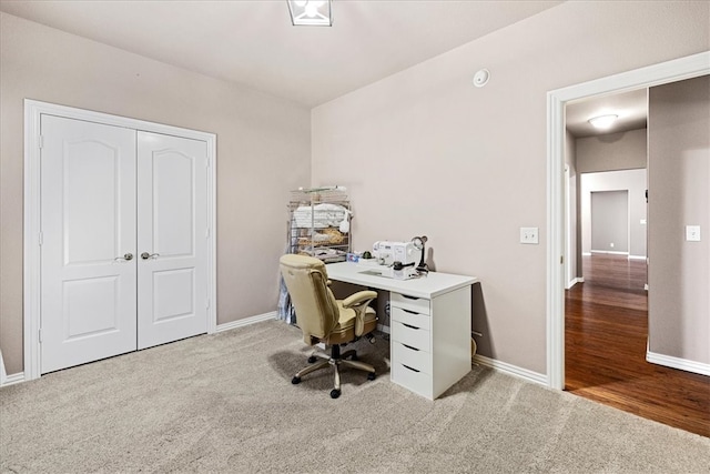 office area featuring light colored carpet