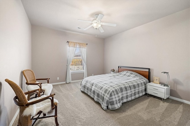 bedroom with ceiling fan and light colored carpet