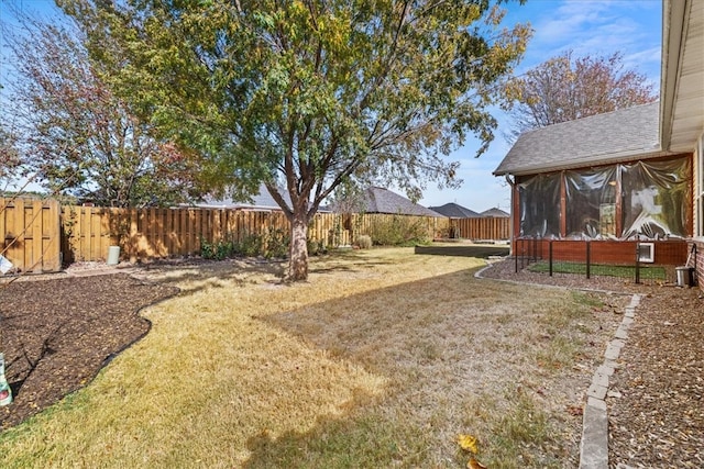 view of yard featuring a sunroom