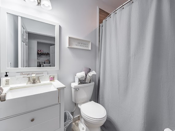 bathroom with vanity and toilet