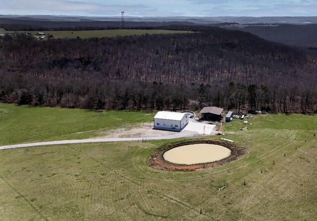 birds eye view of property with a rural view