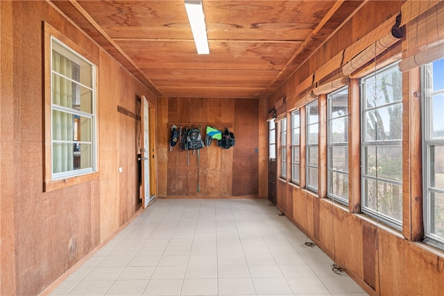 unfurnished sunroom with wooden ceiling