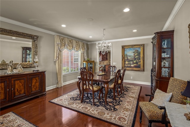 dining area with ornamental molding, an inviting chandelier, and dark hardwood / wood-style floors