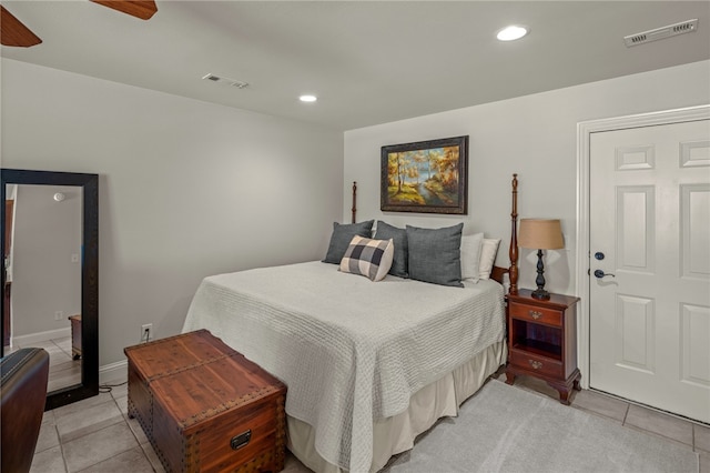 bedroom featuring light tile patterned flooring and ceiling fan