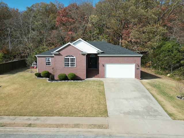 single story home with a front yard and a garage