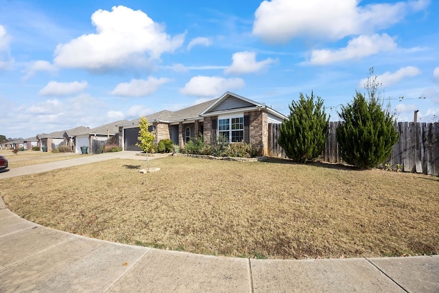 ranch-style house with a front yard and a garage