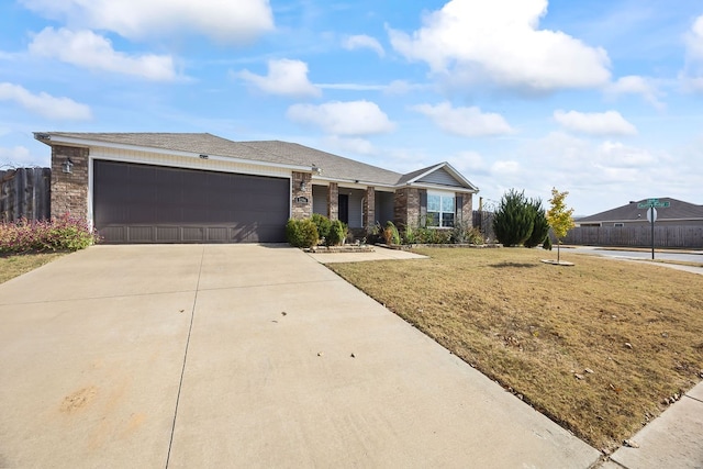 single story home with a front lawn and a garage