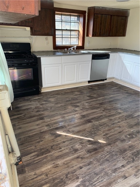 kitchen featuring black gas range, dark hardwood / wood-style floors, sink, stainless steel dishwasher, and white cabinetry