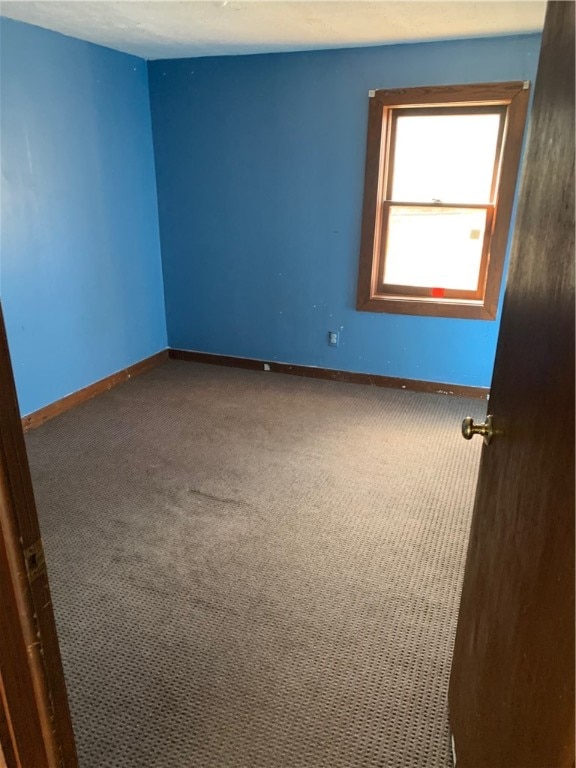 unfurnished room featuring carpet floors