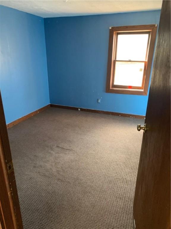 2377 Jordan Rd, Jordan, AR 72658 - empty room with carpet floors and baseboards