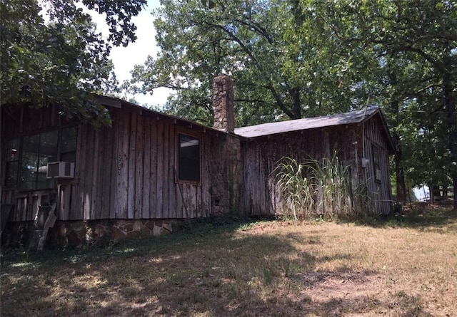 2377 Jordan Rd, Jordan, AR 72658 - view of side of property with a chimney