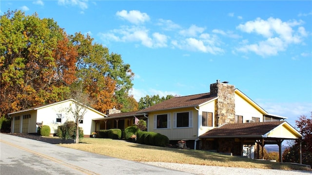 18960 Coppermine Rd, Rogers, AR 72756 - view of property exterior with a yard and a chimney