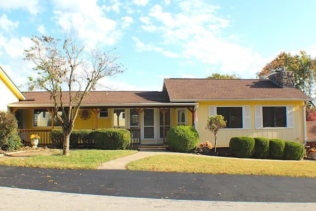 18960 Coppermine Rd, Rogers, AR 72756 - ranch-style home with a chimney and a front yard