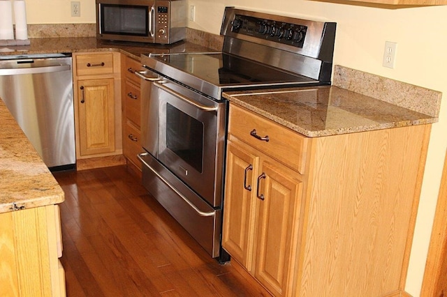 18960 Coppermine Rd, Rogers, AR 72756 - kitchen featuring stainless steel appliances, dark wood-style flooring, and light stone countertops
