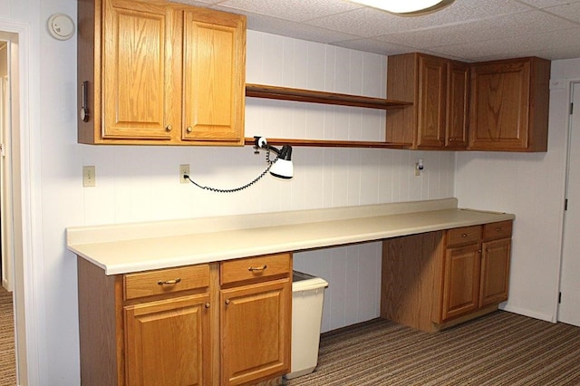 18960 Coppermine Rd, Rogers, AR 72756 - kitchen with brown cabinetry, open shelves, and built in desk