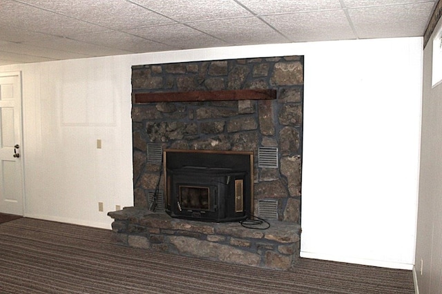 18960 Coppermine Rd, Rogers, AR 72756 - room details featuring visible vents, a paneled ceiling, carpet flooring, and a wood stove