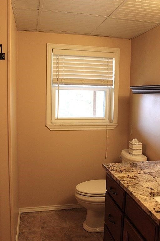 18960 Coppermine Rd, Rogers, AR 72756 - bathroom with tile patterned floors, vanity, toilet, and baseboards