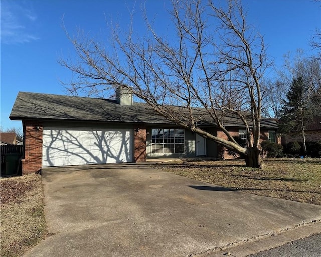 ranch-style house featuring a garage