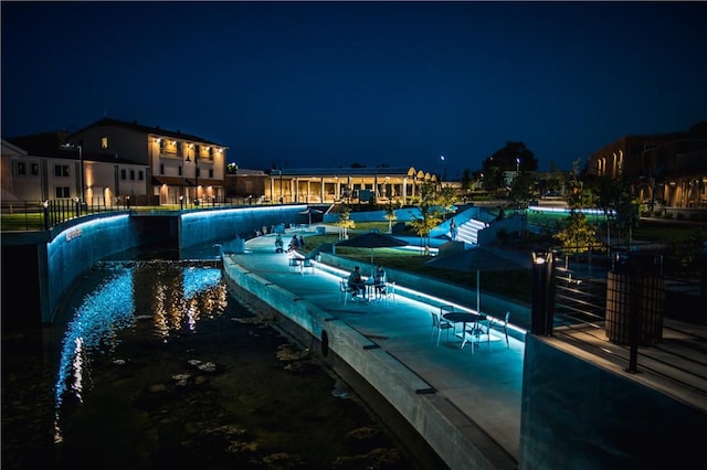 view of pool at night