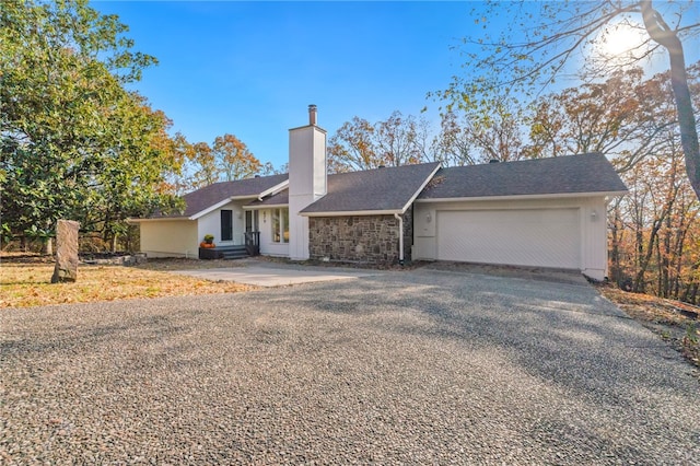 ranch-style house featuring a garage