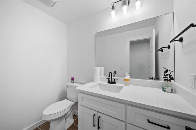 bathroom with hardwood / wood-style floors, vanity, and toilet