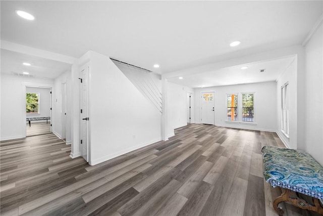 interior space featuring plenty of natural light and dark wood-type flooring