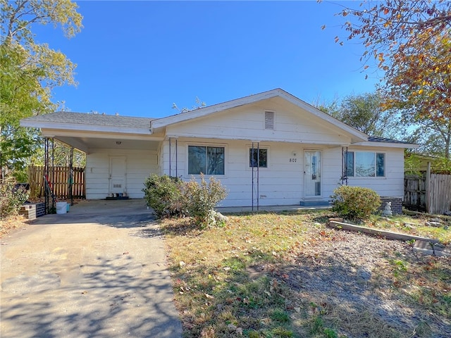 single story home with a carport